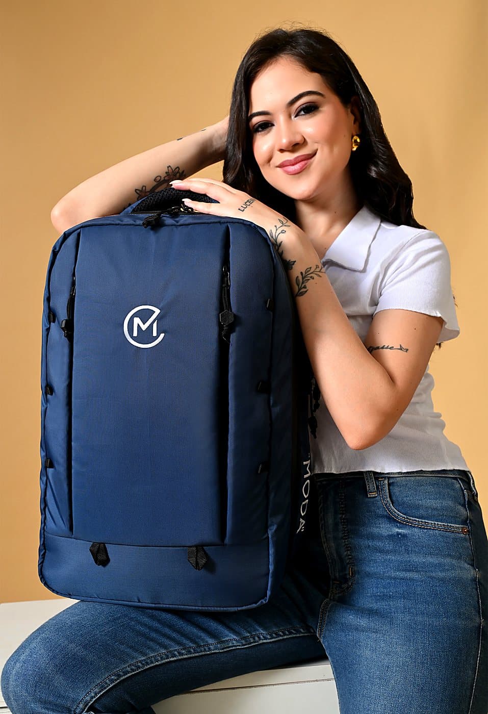 The Nexus One in Club Navy with the Moda monogram embroidered in warm off-white on the front panel