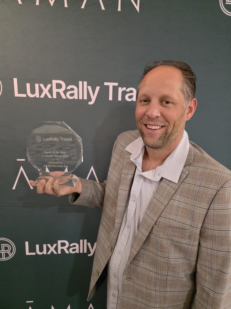 Derek Van Den Top holding his LuxRally Travel Agent of the Year 2025 award