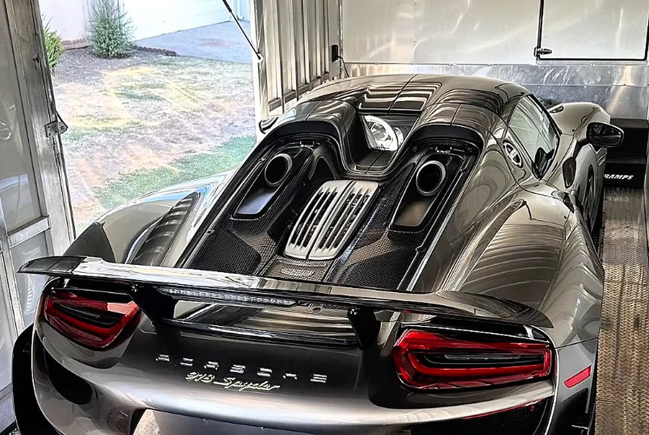 A Porsche 918 Spyder secured inside a Dispatch Dudes enclosed trailer