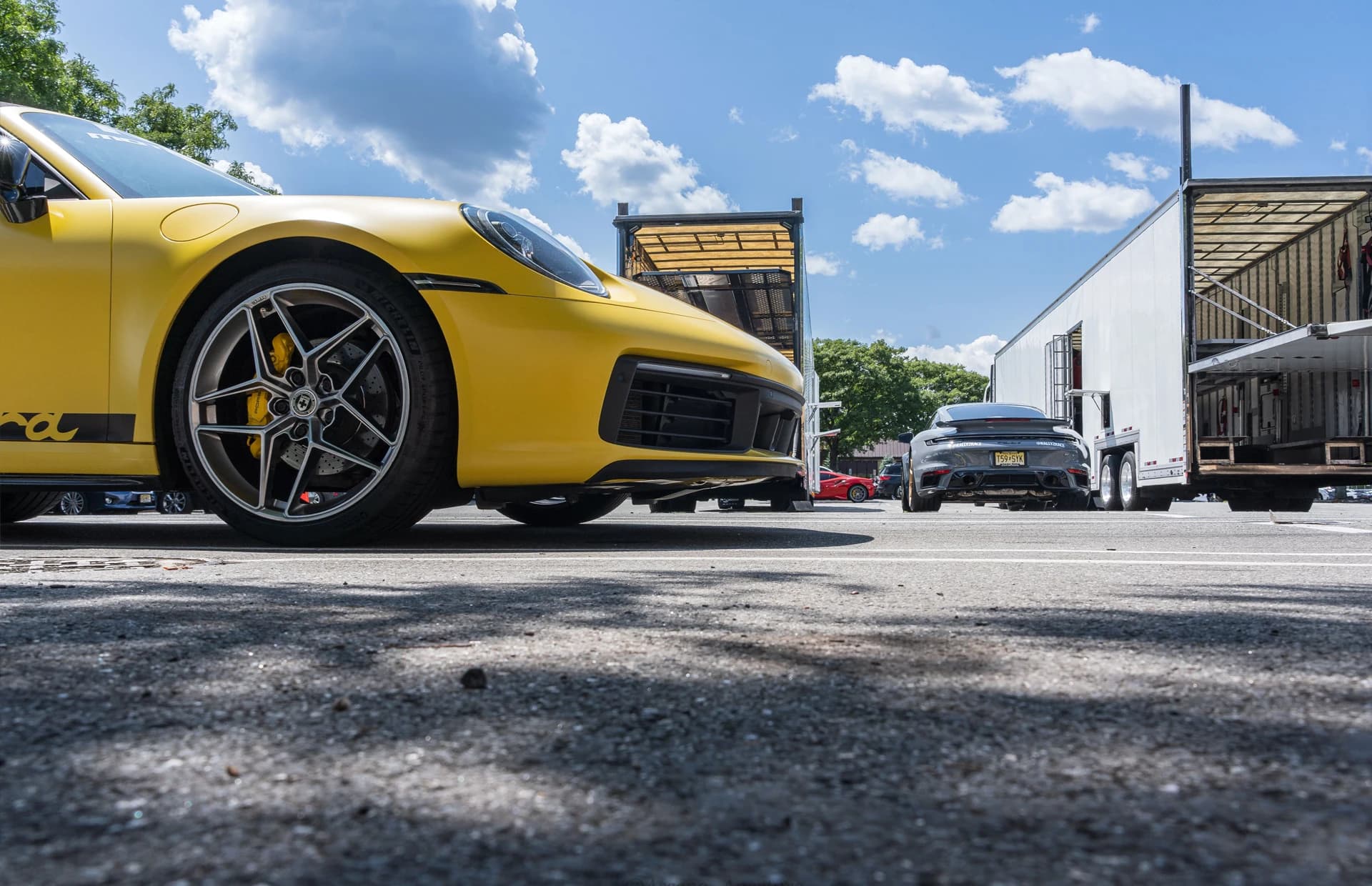 Porsche loaded onto a trailer for expedited car shipping
