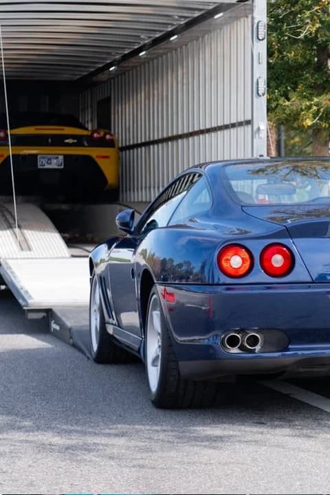 Enclosed auto transport trailer with the door open