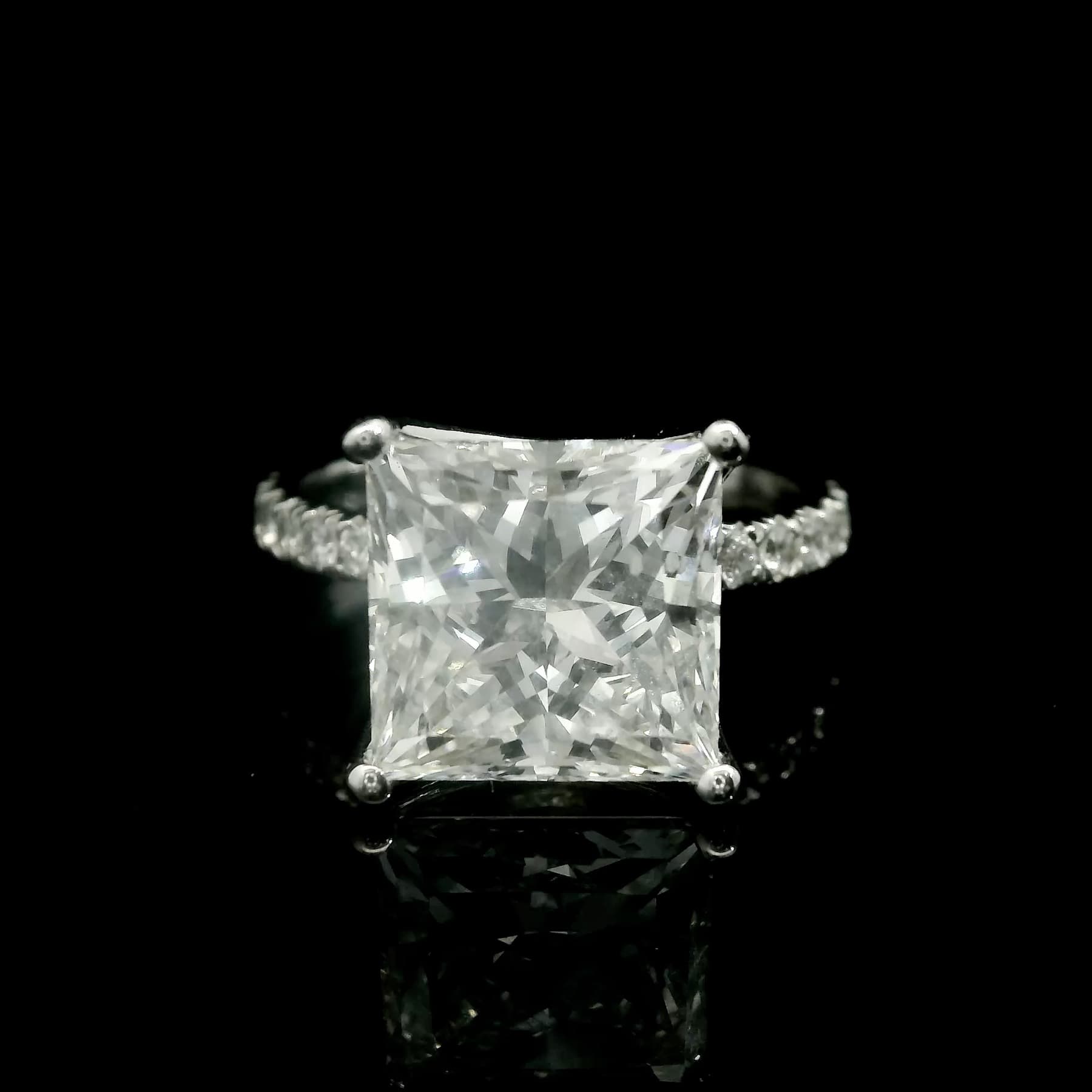 Custom fine jewelry diamond ring with a sculpted band on black