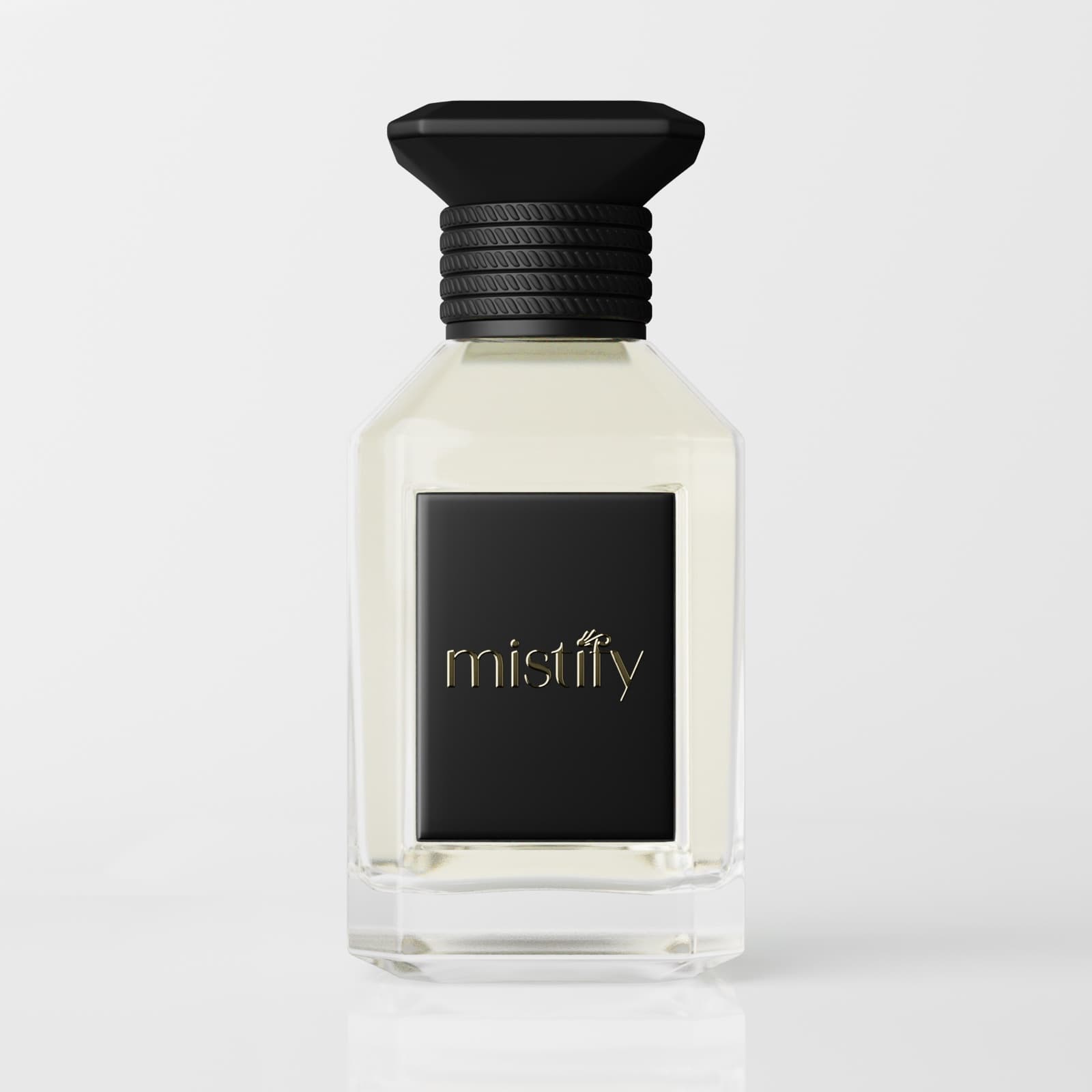 Mistify fragrance bottle with a black and gold label on a soft grey background