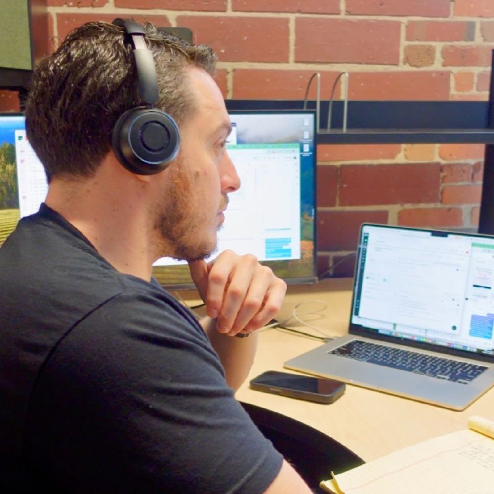 Zach Siegel of Small Biz Heroes working at his desk