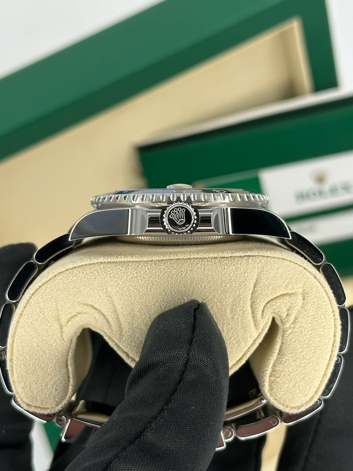 The crown side of a Rolex GMT-Master II 116710BLNR case, showing the screw-down crown with the Rolex coronet between its crown guards