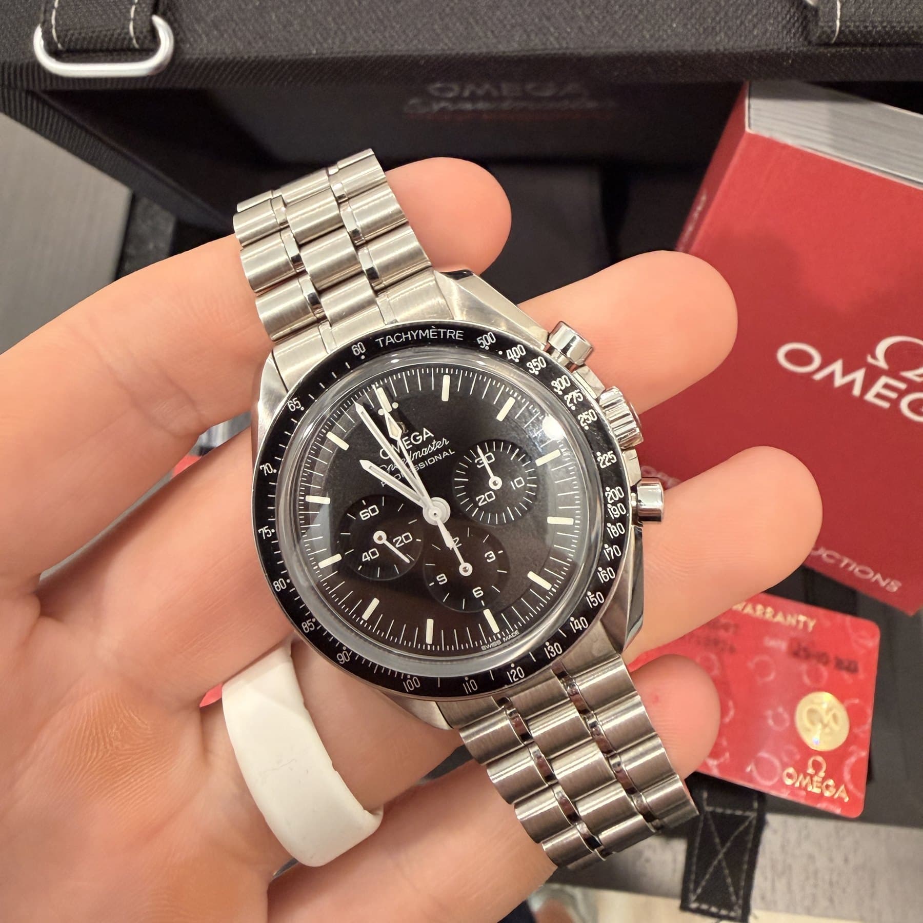 Omega Speedmaster Professional, black dial with tachymetre bezel, on the hand
